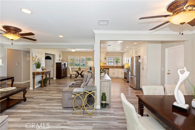 Formal Dining - With a small separation wall, the central area is very open-concept, where the living room, dining room, and kitchen flow together.