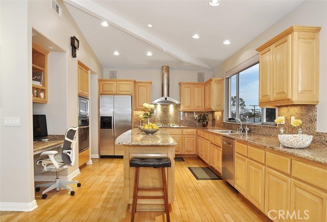 Wonderful Kitchen with High End Appliances and Plenty of Cabinets, plus a Desk.