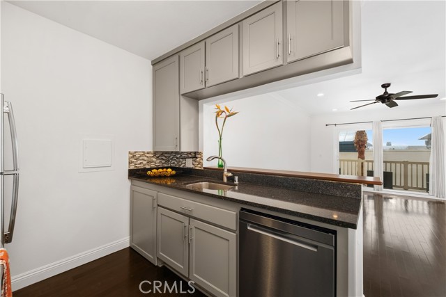 Kitchen with breakfast bar looking to living room