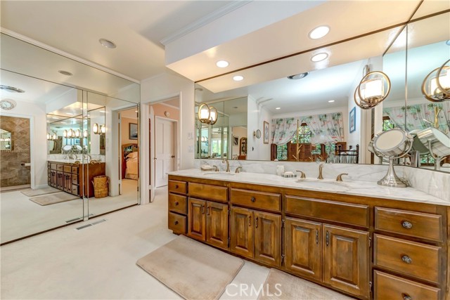 Master bathroom includes mirror sliding door closet