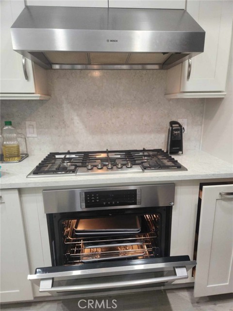 BUilt in oven. 5 burner stove top. Built in exhaust-light