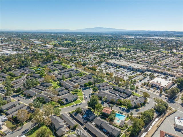 Neighborhood drone toward shopping center.