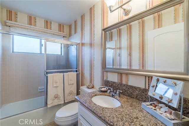 The fourth bathroom is conveniently located between the fourth bedroom and the garage and across the hallway from the laundry area.