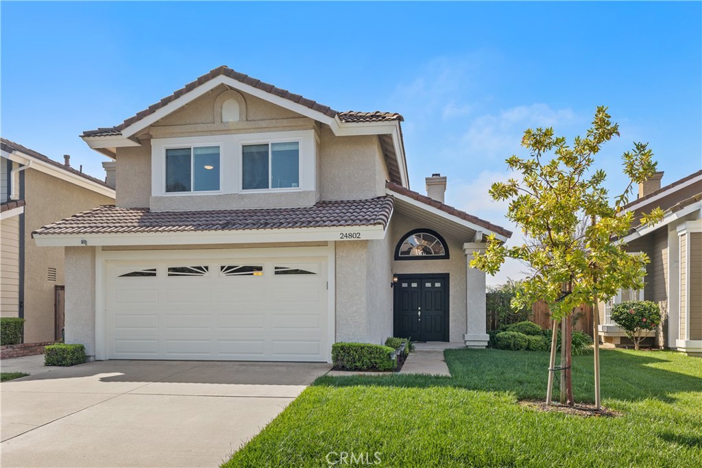 This magnificent 3 bedroom/3 bath home is over-the-top in upgrades and is perfect for entertaining. Remarkable solid surfaces, charming curb appeal, and attention to every detail. From the brand-new front doors to the private and tranquil backyard with a tree-top view that features a built-in barbecue island/bar, fire pit, lemon trees, putting green, and finished off with exceptional hardscape. Distressed wood plank flooring flows throughout the living areas with the exception of carpet in the bedrooms. The living and dining rooms feature tall ceilings with plenty of natural light. The great room is encompassed by maple kitchen cabinetry, quartz countertops and backsplash, stainless steel sink, and stainless-steel appliances. The kitchen and family room (great room) have a picturesque backyard view with a warm and pristine fireplace. There is also a spacious half bath with wood flooring located across the hall from the laundry room. The main bedroom suite features hills and tree top views, vaulted ceiling, two closets, tiled flooring, a quartz vanity top, maple cabinetry, soaking tub, and a tiled shower that has the elegance with a frameless glass surround. The other 2 bedrooms feature front yard views as the home is located on a single loaded street. This property also includes a upgraded hall bath with a shower situated in the porcelain steel tub accompanied by a beautiful tiled area. Dual pane windows are also throughout most of the home. This gorgeous home is fully equipped with appliances including GE, LG, Maytag, KitchenAid and fixtures from KOHLER, KraftMaid and VANITYART. Close proximity to schools, shopping, and restaurants. Welcome home!