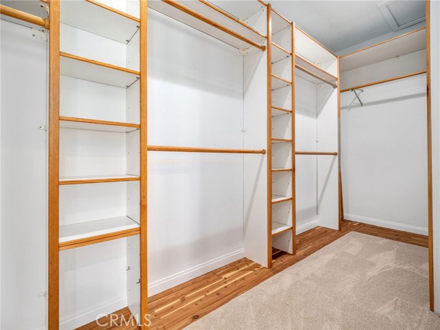 Primary bedroom walk-in closet