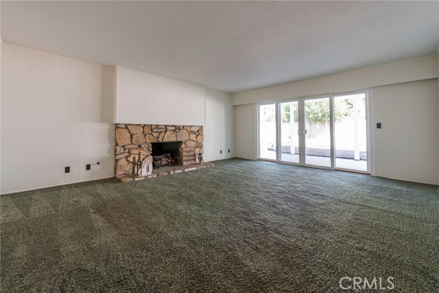 Huge family room with stone fireplace