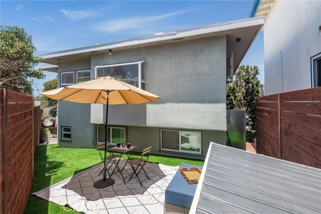Backyard with turf is a great place to enjoy the sunshine