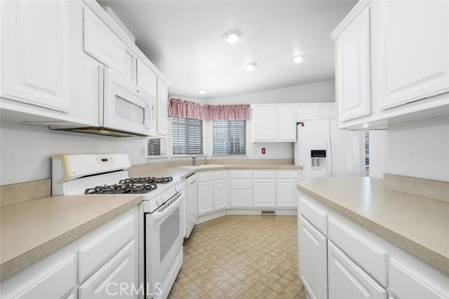 spacious kitchen with plenty of countertop space.