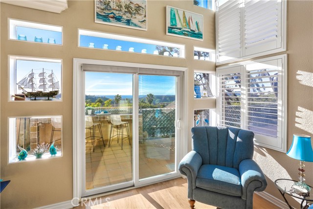 The sliding glass door leading to your gigantic ocean view backyard. You can see the ocean, harbor and Catalina Island from your living room.