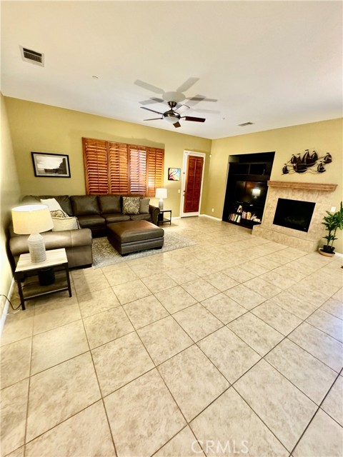 Open concept living area with access to pool outside