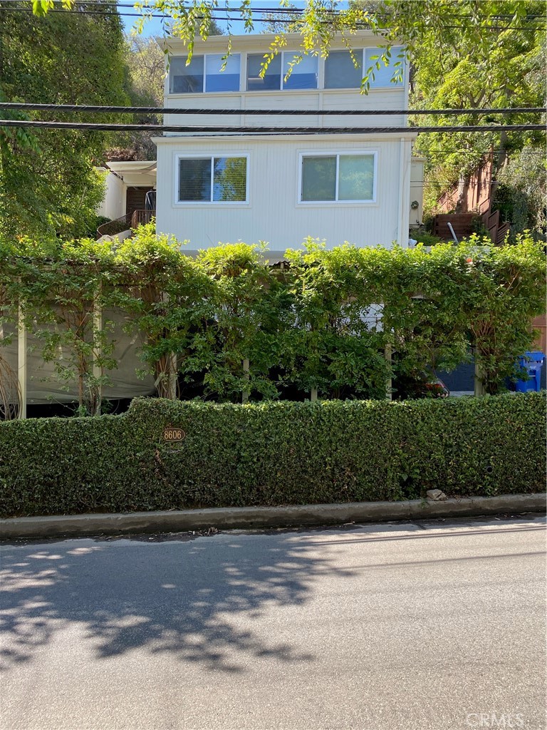 Fabulous, updated Mid-century 2 bed 2.5 bath, jacuzzi, 4 car parking, solar roof, with great tree and some city views.