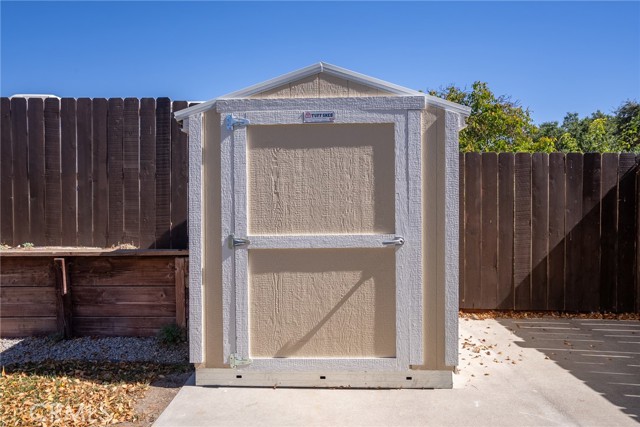 The shed would be a great spot to store yard equipment.