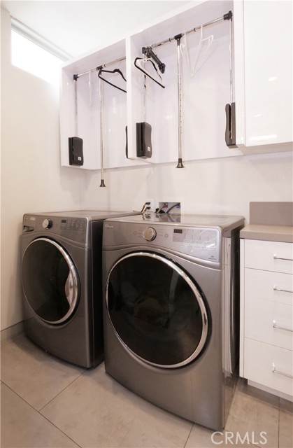 Laundry room with storage.