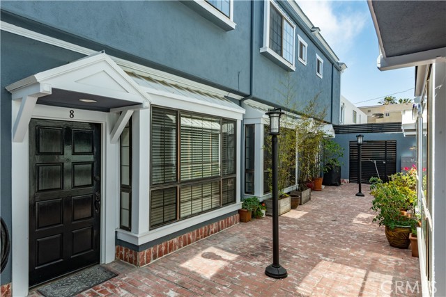 36 Navy Street 8 Venice, California Beautifully remodeled townhome located 1/2 block to the sand in the best North Venice location and one block to Main Street in Santa Monica. Everything has been updated in this lovely home. The main level features an open floor plan with a gas fireplace in the living room, dining area, elegantly updated modern chef's kitchen with new stainless steel appliances, and a half bath. The second level offers two bedrooms each with fully updated baths, and laundry. The gated entry opens to an enclosed courtyard where you can enjoy the refreshing ocean air. There are two tandem parking spots, ample storage, and 3 guest parking spaces.