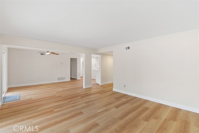 Hallway door leads to two large bedrooms and a remodeled full bathroom