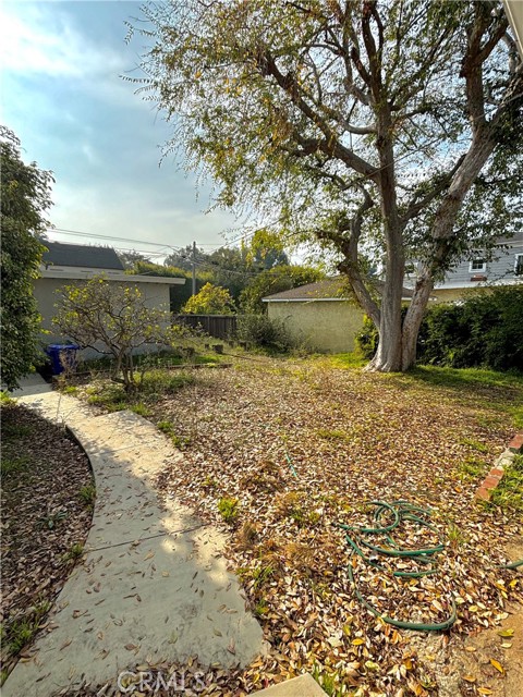 Backyard looking from home to 2 car garage.