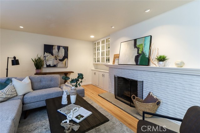 Fireplace and built in bookshelves.