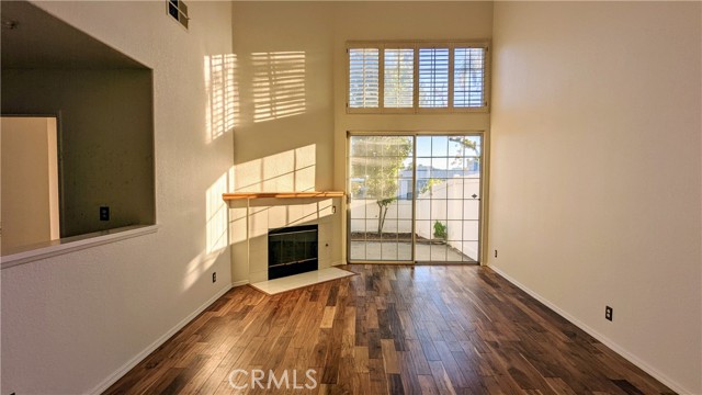 Living room sliding door lead to private rear yard