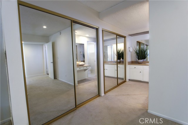 Master Bedroom with Mirrored Closet & Laundry Chute