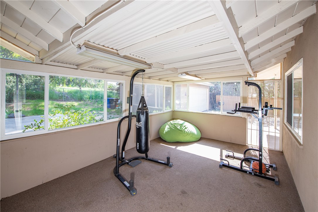 The attached sunroom is the ideal spot for a gym, playroom or office.