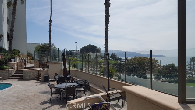 Newly renovated pool deck and patio area in a resort setting.