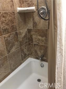 Full bathroom with tile.