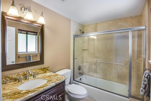 Upgraded tile and counter top in the bathroom connected to the middle (blue) bedroom on top level.