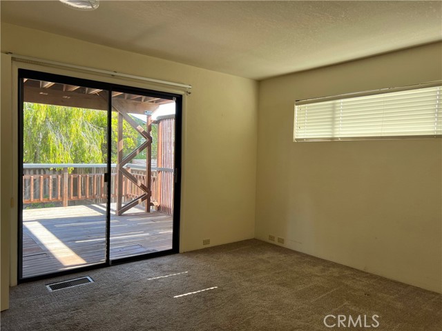 BEDROOM LOWER LEVEL WITH LOWER LOWER DECK ACCESS