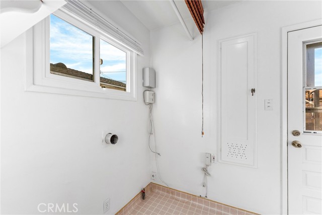 Laundry Room/Mudroom leads outside to rear yard