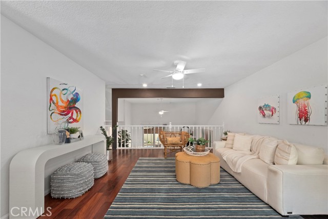 Spacious den overlooks living room