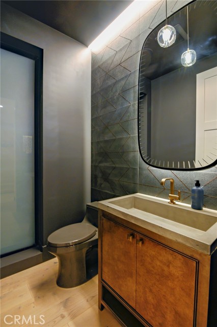 downstairs powder bath with dramatic features