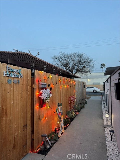Walk way to the carport and back of the units.