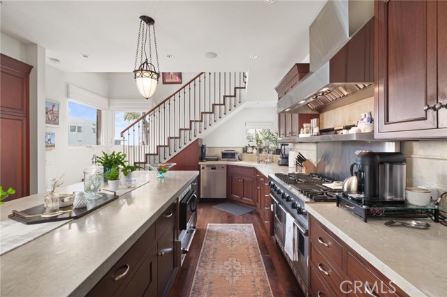 Open kitchen and stairwell to fun zone