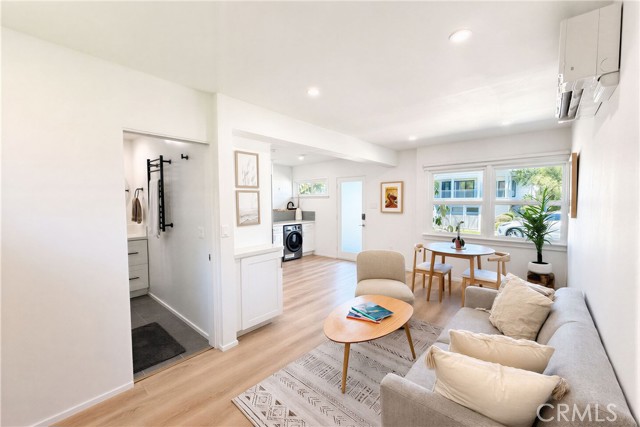 Turn-key lower unit offers a bright and beautiful layout with wide plank flooring, updated kitchen, recessed lights and an open concept design