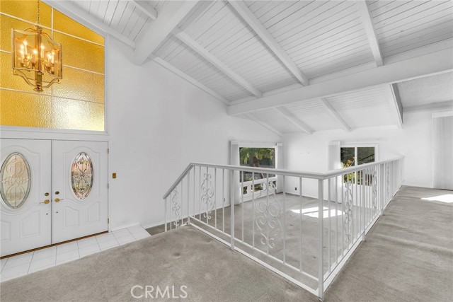 View of entrance and living room with picture window.