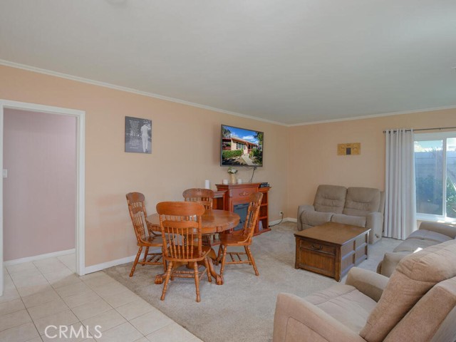 View of living, dining, entry and central hall to 3 bedrooms