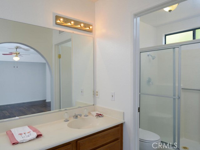 Downstairs primary bath with dual sinks and full size shower