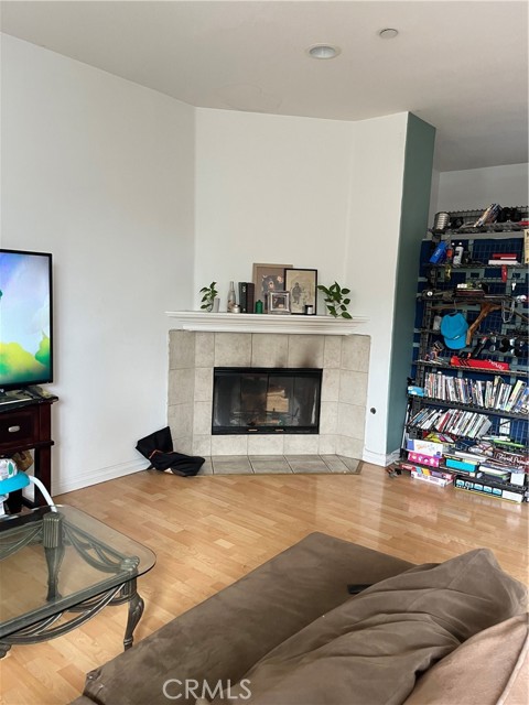 Elegant living room with cozy fireplace, smooth ceilings!