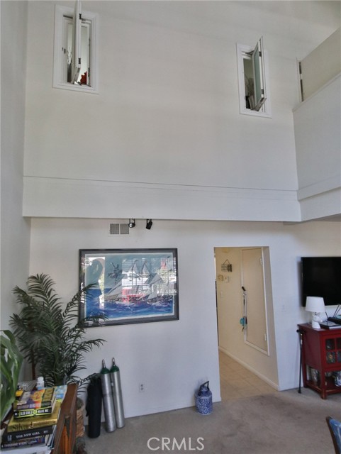 This shows the two story living room and two added windows that allow air flow through the master bedroom.