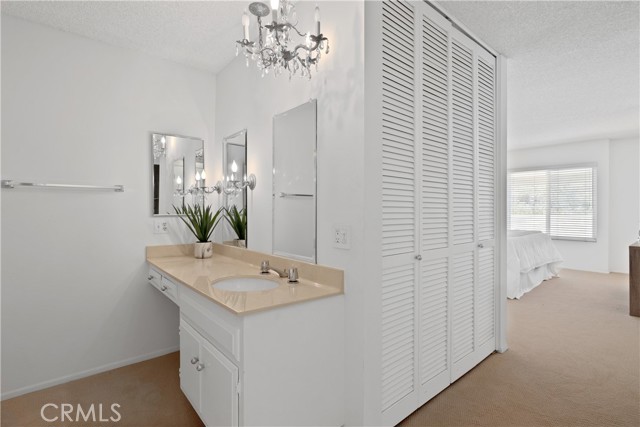 The primary suite is a spacious bedroom closet, and primary bath with dual vanities.