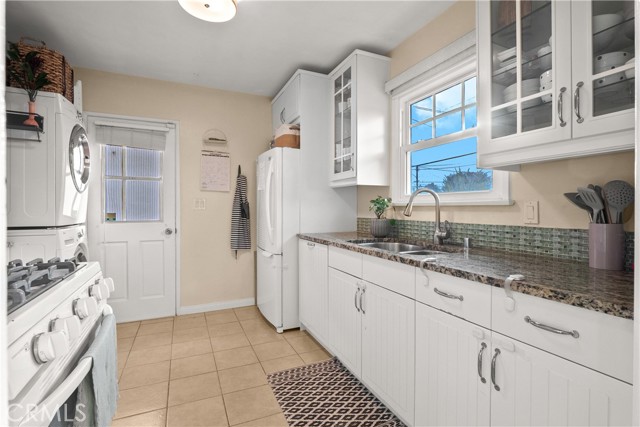 granite countertop with glass tile backsplash