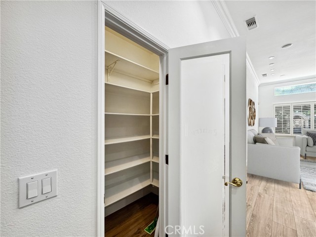 Oversized walk-in pantry.
Photos depict virtual staging and are not representative of current furnishings in the home.