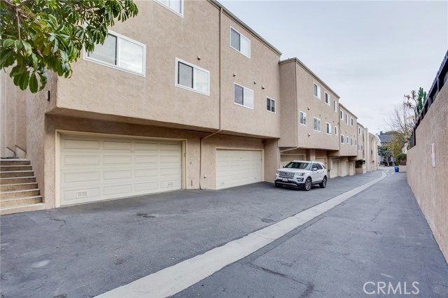 Entry driveway with direct access to unit's garage