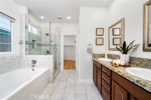 This bathroom was completely renovated in the past with permits. Enjoy a separate shower /  tub feature, along with dual sinks, and a huge walk-in closet.