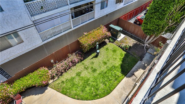 Grass area for dogs, with bags and trash can for easy clean up
