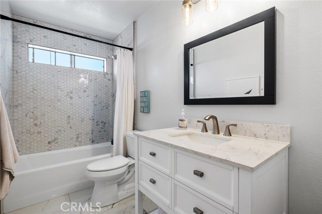 Remodeled in 2022: Full Guest Bath with Quartz Countertops, new tile floors and new fixtures.