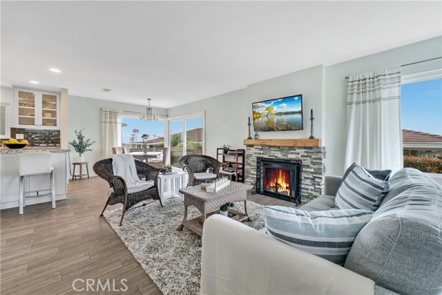 Open concept living with porcelain tile floors throughout that look like wood