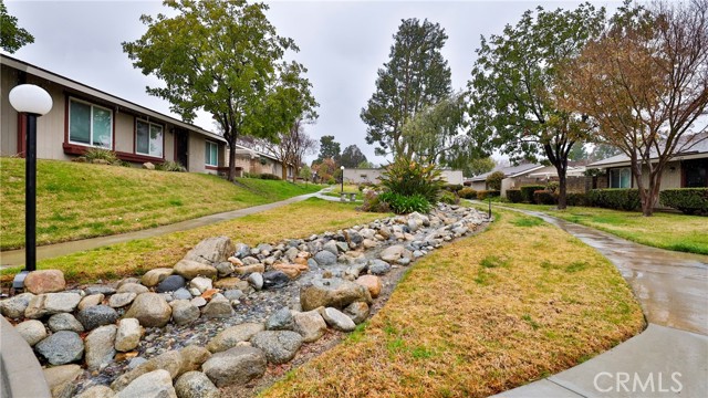 Community Landscaped with Running Water Creeks, Green Grass, Mature Landscaping