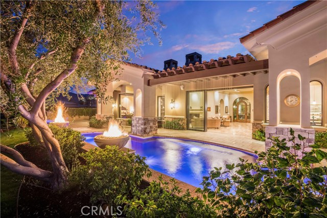 43312 Via Siena Indian Wells, California Beautiful and stunning custom built home overlooking the Jack Nicklaus 18th Fairway South Course! Attention to detail was given to every inch in the building and design of this home and guest home. From the first moment you step through the grand Tuscanny entry be prepared to be over impressed. This Five Bedroom, Five and One half bath features and overbuilt look, extensive vaulted ceilings, massive use of Weiland Sliding Doors that open to a picture perfect pool, spa and entertaining area with outdoor BBQ and kitchen with fire pit. Beyond the pool and past the fire chalices this property looks directly out onto and across the 18th fairway on the South Course. The generously large master bedroom faces the golf course as well and directly outside the ultra private private spa separate from the pool. Between the home and the drive is a large Casita detached from the house with its own kitchenette and 2 master bedrooms. Don't miss the select temperature controlled and secure wine cellar room. All of the garage spaces make storing and maintaining multiple vehicles with three separate doors, epoxy flooring and solar service. The dual solar system allows for for full home use with minimal power. Dont miss out on this fabulous rare opportunity.