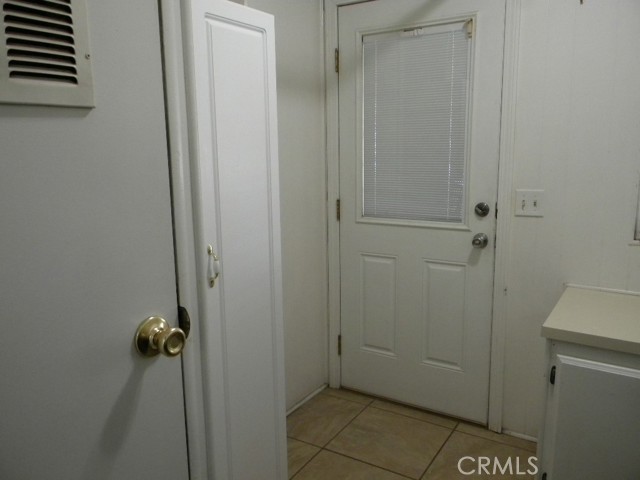 Laundry room has cabinets and folding area